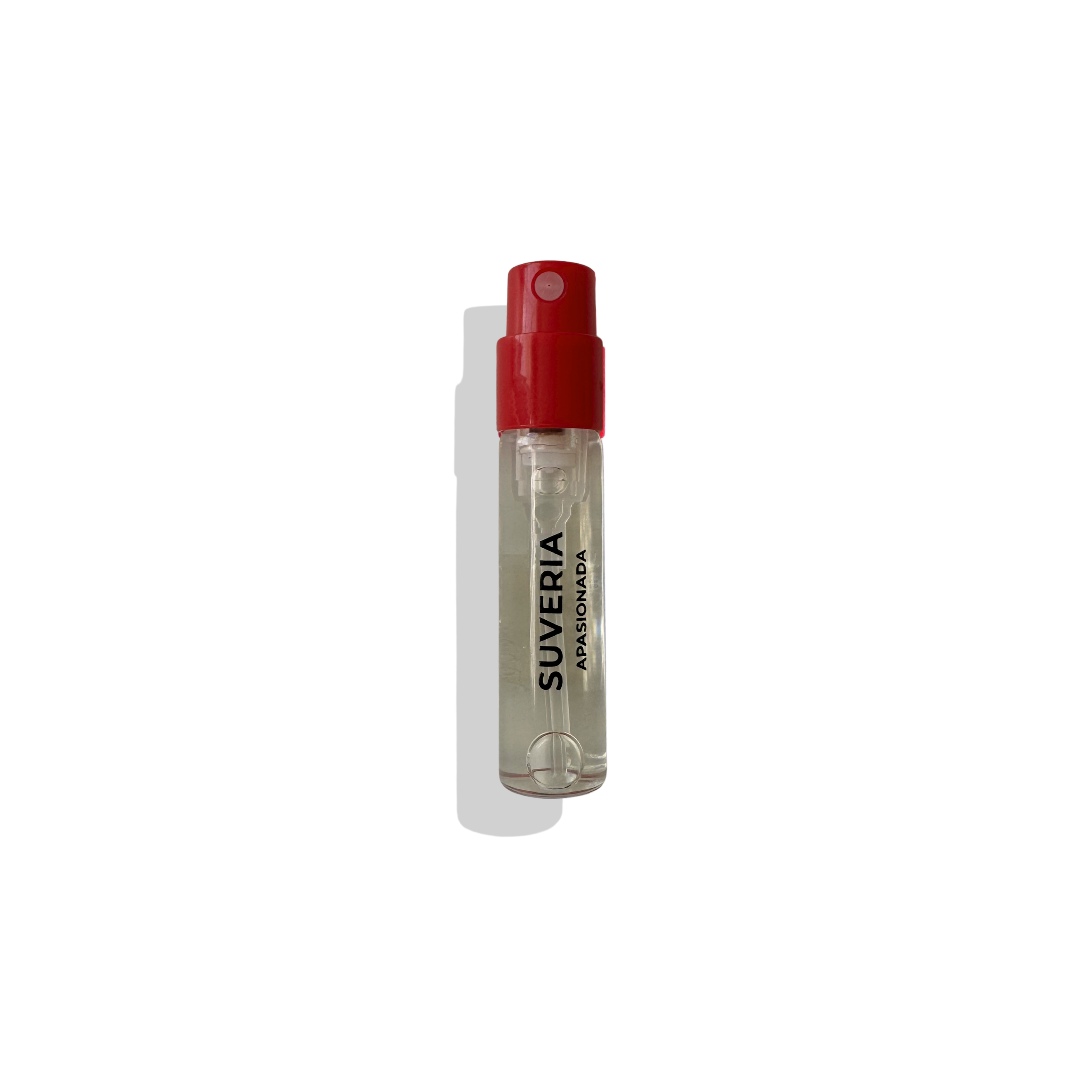 Small spray bottle with red cap and clear body on a white background